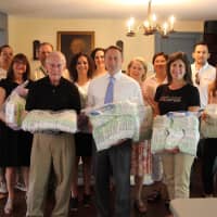 <p>County Executive Robert P. Astorino, the JLCW and local State Farm agents packaged diapers for the Westchester County Diaper Bank.</p>