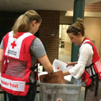 <p>Red Cross Volunteers helping fire victims in Peekskill.</p>