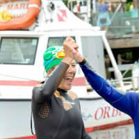 <p>Swimmers celebrate at the finish last year.</p>