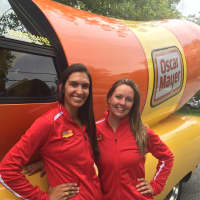 <p>Angela Bumstead, left, and Alissa Endres in front of the Wienermobile.</p>