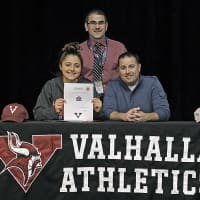 <p>Brandi Coon signing her letter of intent for college with Athletic Director Jamie Block and Coach John Hayes. </p>