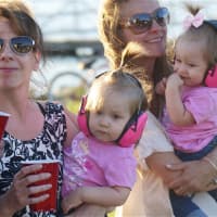 <p>Twin girls Emma and Morgan Cafaro make sure their ears are protected at Wednesday night&#x27;s show. </p>