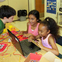 <p>Students use alligator clips to circumvent keyboards and play video games.</p>