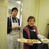 <p>Volunteers served the guests at Thursday&#x27;s dinner. </p>