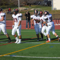 <p>Teammates congratulate Brandon Williams (#12) after his touchdown. White Plains lost to Stepinac, 19-18 in the final minute of the 42and annual Turkey Bowl Thursday. </p>