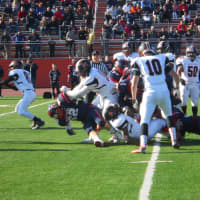 <p>White Plains&#x27; Ari Shamery is tackled by Stepinac&#x27;s defense in the Crusaders&#x27; 19-18 win in the 42nd annual Turkey Bowl Thursday.</p>