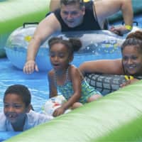 <p>Big crowds turn out to Slide the City on Sunday in Stamford.</p>