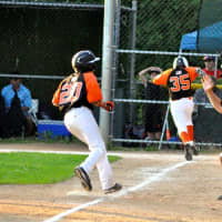 <p>Two White Plains&#x27; baseball players score en route to their 12 and under Division 20 championship final.</p>