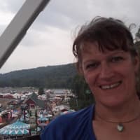 <p>Kerri McCaffrey, formerly known as Herb in Hawthorne, on a ferris wheel at the Wayne County Fair in Pennsylvania where she took her sons last summer.</p>