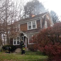 <p>The roof of the home at 53 Washington Ave. in Westport caught fire Sunday morning. </p>