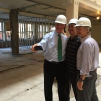 <p>Bridgeport Mayor Bill Finch poses for a selfie Tuesday at the construction site of a renovated building in Downtown North.</p>