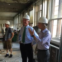 <p>Bridgeport Mayor Bill Finch talks with a developer at a construction site in Downtown North Tuesday.</p>