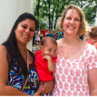 <p>Laila Bravo holds her 7-month-old daughter while standing beside Kim Petrone, right, of Malta House in Norwalk.</p>