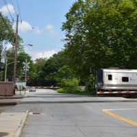 <p>A passing train at the grade crossing in downtown Katonah.</p>