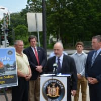 <p>New Castle Supervisor Rob Greenstein speaks at a Katonah press conference about grade-crossing safety.</p>