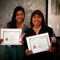 <p>Abbie Rodriguez, left, and her mother, Herlinda S. Binuya, were both sworn in as American citizens on July 24.</p>