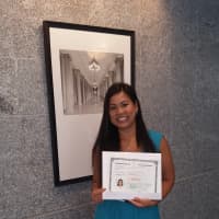 <p>Abbie Rodriguez displays her U.S. citizenship certificate.</p>