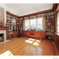<p>There are two fireplaces in the home, including one in a large library.</p>