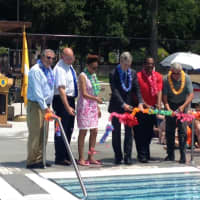 <p>White Plains Mayor Tom Roach, center, and Recreation &amp; Parks Commissioner Wayne Bass (in red shirt) at Wednesday&#x27;s ribbon-cutting ceremony. Kittrell Pool was in need of an upgrade and I am thrilled with the result,&#x27;&#x27; Bass said.</p>