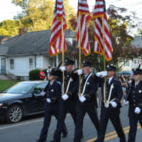 <p>Mahopac firefighters march in the Brewster parade.</p>