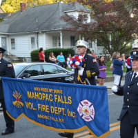 <p>Mahopac Falls firefighters march in the Brewster parade.</p>
