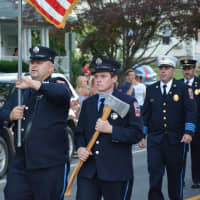 <p>Putnam Lake firefighters march in the Brewster parade.</p>