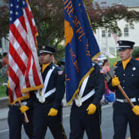 <p>Somers firefighters march in the Brewster parade.</p>
