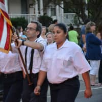 <p>Katonah Bedford Hills Volunteer Ambulance Corps (KBHVAC) members march in the Brewster parade.</p>