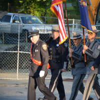 <p>A color guard marches in the Brewster firefighters&#x27; parade.</p>