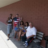 <p>Those who had to be outside found a shady spot at the Putnam Plaza.</p>