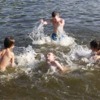 <p>Kids cool down in the water at Lake Lincolndale in Somers. </p>