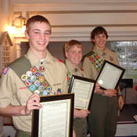 <p>From left: Kyle Monk, Matthew Scavarda, and Axel Beyer achieved the rank of Eagle Scout last week.</p>