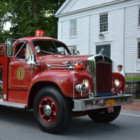 <p>A vintage Bedford firetruck is driven in the parade.</p>
