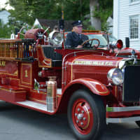 <p>A vintage Bedford Hills firetruck is driven in the Bedford Village parade.</p>