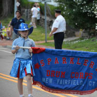 <p>Kids in the Sparklers Drum Corps march in the Bedford Village parade.</p>