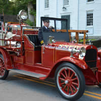 <p>A vintage South Salem firetruck is driven in the Bedford Village parade.</p>