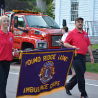 <p>Pound Ridge Lions Ambulance Corps members march in the Bedford Village parade.</p>