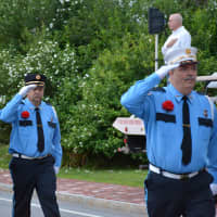 <p>Mill Plain (Danbury) firefighters march in the Bedford Village parade.</p>