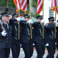 <p>Ossining firefighters march in the Bedford Village parade.</p>