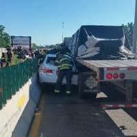 <p>This multi-vehicle accident involving a car and tractor that initially took out two lanes on northbound I-95 in New Rochelle Friday.</p>