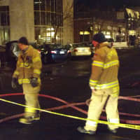 <p>Stamford firefighters respond late Tuesday to an underground blaze downtown. </p>