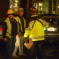 <p>Members of Connecticut Light &amp; Power investigate the cause of a fire Tuesday night in downtown Stamford. </p>