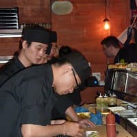 <p>Eric Cheng, head chef at Pink Sumo Sushi &amp; Sake Cafe in Westport, prepares a dish Tuesday afternoon. </p>