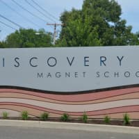 <p>The signs design resembles layers of Earth reflecting the math and science focus of the school. </p>