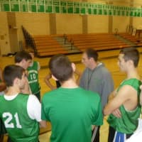 <p>Irvington boys basketball coach Mike Auerbach, in grey, will lead his Bulldogs in the William Tewey Basketball Tournament.</p>