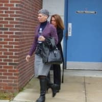 <p>Cari Luciano (behind woman in purple) and Anna Lane (not pictured) are asking to be compensated for assault and emotional distress, among other charges.</p>