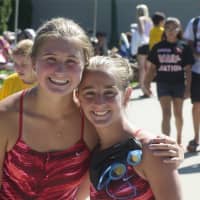 <p>Two members of the Whippoorwill Swim Team pose for a photo.</p>
