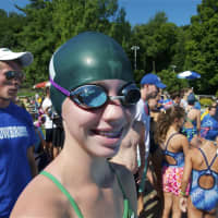 <p>Emma Halderman of Yorktown waits for her turn to swim.</p>