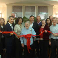 <p>The staff and first residents of Maplewood at Darien celebrate the opening with a ribbon cutting alongside Chamber of Commerce members.</p>