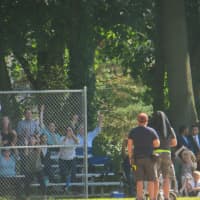 <p>Parents acting as Little League baseball fans cheer their Hawks team on Tuesday from bleachers behind the backstop at Rye High School on Tuesday for the 12-part Showtime television pilot &quot;Billions,&#x27;&#x27; set to air next year. </p>
